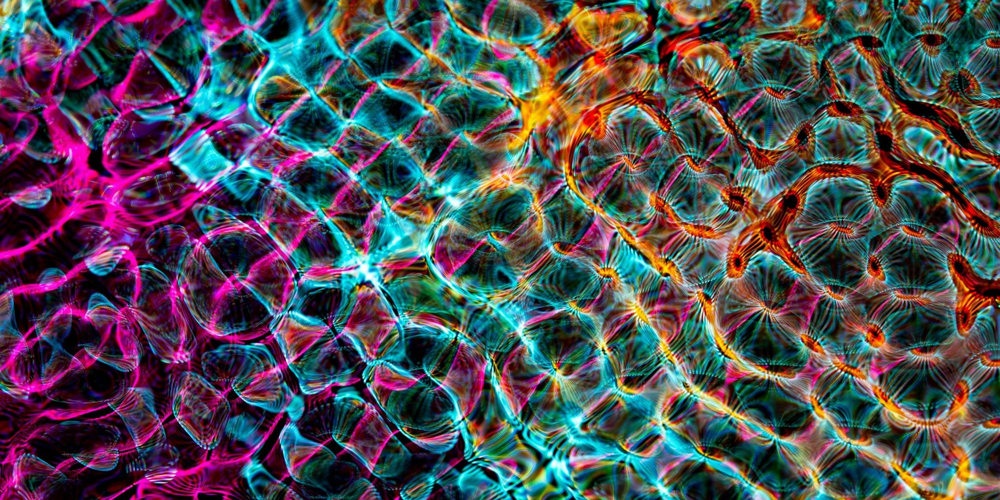 Colorful abstract pattern with pink, blue, and orange hues